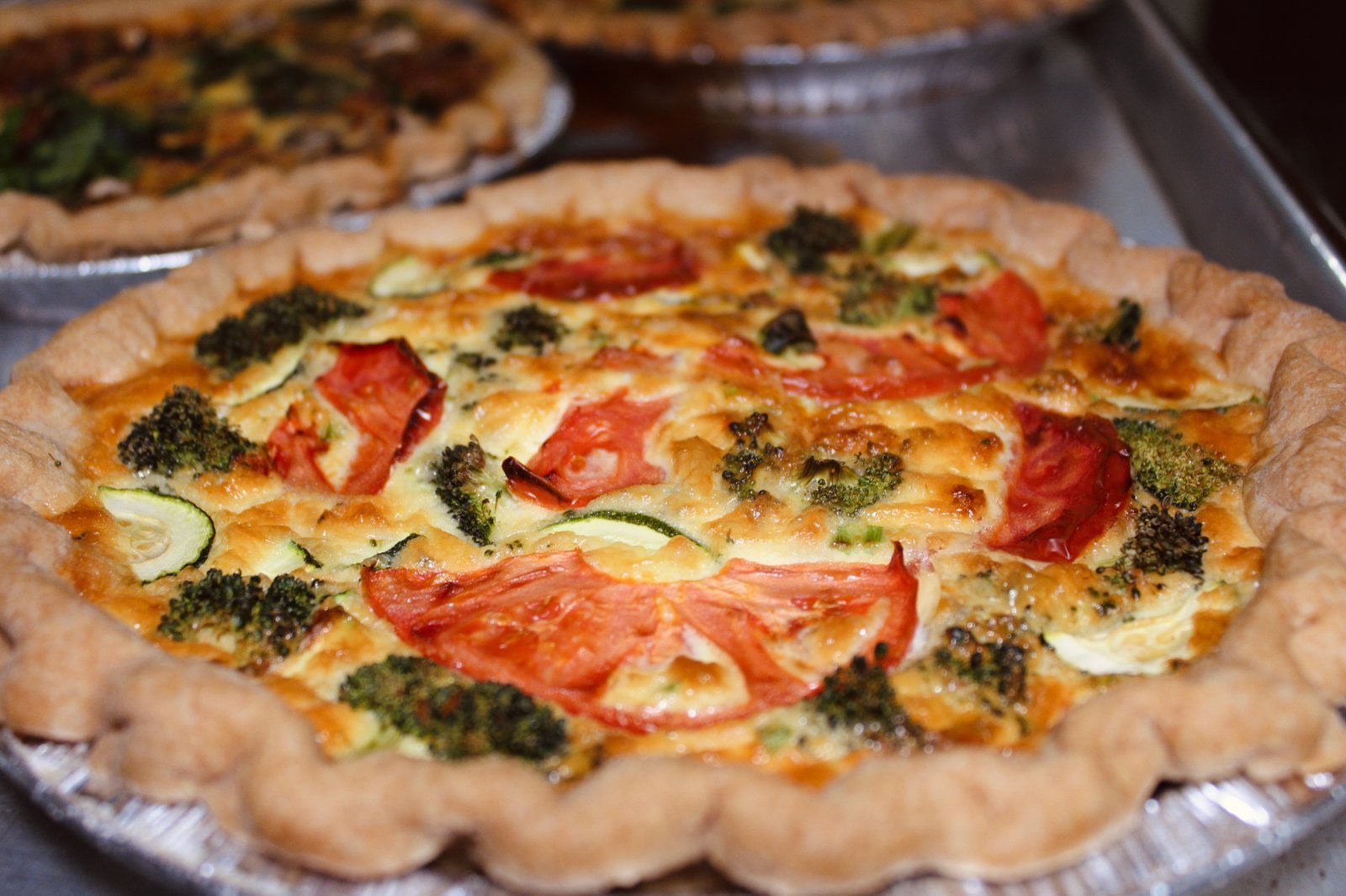 Fresh-baked veggie quiche ready for online ordering